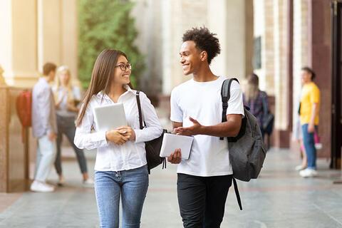 Two students walking and talking